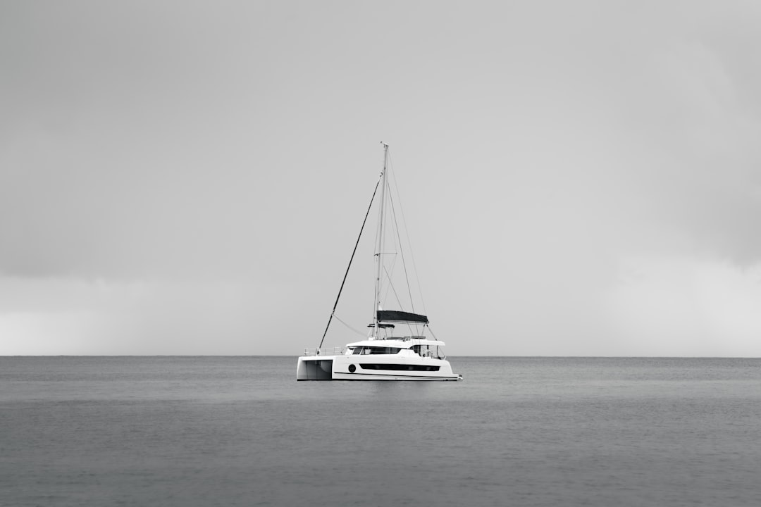 What We’re Looking for in Our First Liveaboard Catamaran Catamaran sailing across clear tropical water